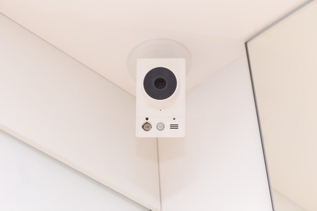 cctv camera hanging on the ceiling of the apartment video surveillance system estate real estate t20 nob0LP