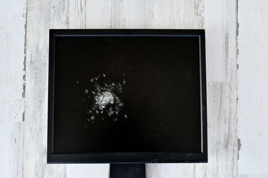 concept a broken smashed computer monitor to represent the internet or network being down and t20 bxj9e9