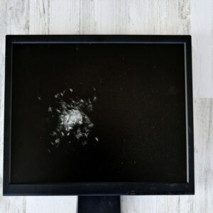 concept a broken smashed computer monitor to represent the internet or network being down and t20 bxj9e9