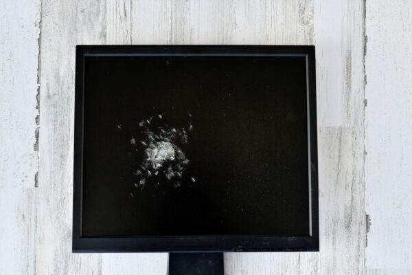 concept a broken smashed computer monitor to represent the internet or network being down and t20 bxj9e9