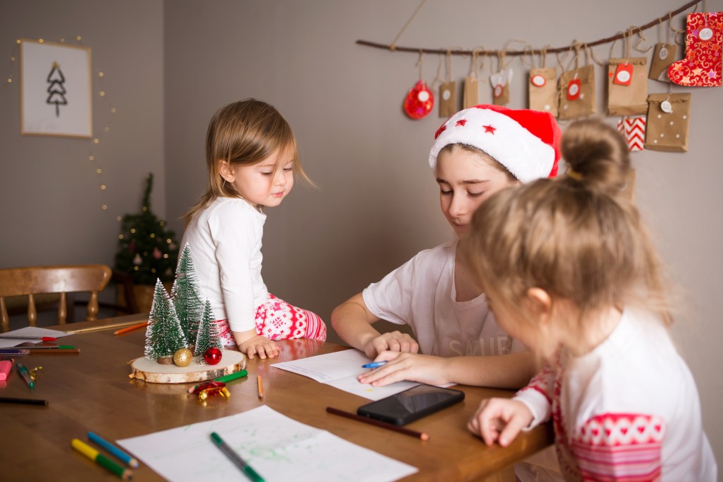 sisters girls draw on background of christmas devoration concept of new year kids preparation and t20 P0yxkR